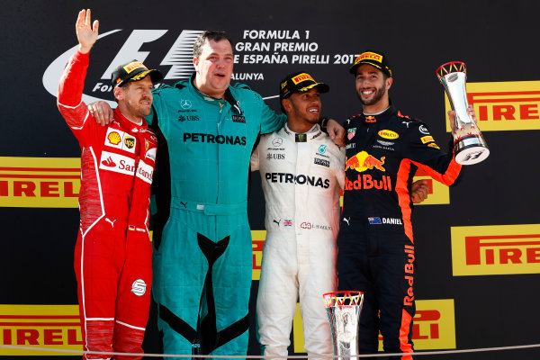 Circuit de Catalunya, Barcelona, Spain.
Sunday 14 May 2017.
Sebastian Vettel, Ferrari, 2nd Position, Karl Fanson, Mechanic, Mercedes, Lewis Hamilton, Mercedes AMG, 1st Position, and Daniel Ricciardo, Red Bull Racing, 3rd Position, on the podium.
World Copyright: Glenn Dunbar/LAT Images
ref: Digital Image _X4I9293