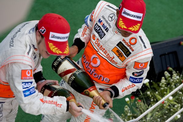 2007 Malaysian Grand Prix
Sepang, Kuala Lumpur. Malaysia.
6th - 8th April 2007.
Fernando Alonso, McLaren MP4-22 Mercedes and Lewis Hamilton, McLaren MP4-22 Mercedes celebrate with champagne on the podium. Portrait. Podiums.
World Copyright: Steven Tee/LAT Photographic
ref: Digital Image YY2Z7669