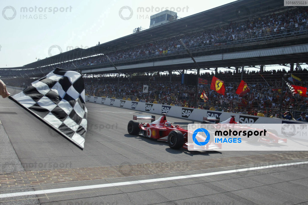 Rubens Barrichello, Ferrari F2002, (nearest camera), wins from Michael Schumacher, Ferrari F2002, who had slowed as he approached the finish line to allow his teammate alongside. Rubens Barrichello, Ferrari F2002, (nearest camera), wins from Michael Schumacher, Ferrari F2002, who had slowed as he approached the finish line to allow his teammate alongside.