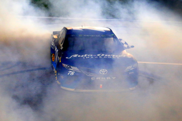 Monster Energy NASCAR Cup Series
Go Bowling 400
Kansas Speedway, Kansas City, KS USA
Saturday 13 May 2017
Martin Truex Jr, Furniture Row Racing, Auto-Owners Insurance Toyota Camry celebrates his win with a burnout 
World Copyright: Russell LaBounty
LAT Images
ref: Digital Image 17KAN1rl_5818