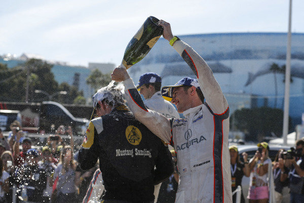 #5 Mustang Sampling Racing Cadillac DPi, DPi: Joao Barbosa, Filipe Albuquerque, #6 Acura Team Penske Acura DPi, DPi: Juan Pablo Montoya, Dane Cameron, #7 Acura Team Penske Acura DPi, DPi: Helio Castroneves, Ricky Taylor celebrate on the podium with champagne #5 Mustang Sampling Racing Cadillac DPi, DPi: Joao Barbosa, Filipe Albuquerque, #6 Acura Team Penske Acura DPi, DPi: Juan Pablo Montoya, Dane Cameron, #7 Acura Team Penske Acura DPi, DPi: Helio Castroneves, Ricky Taylor celebrate on the podium with champagne
