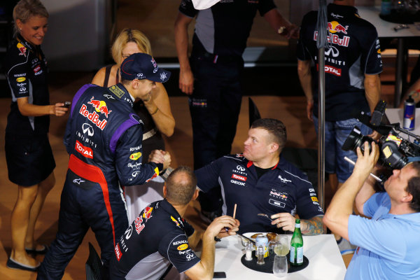 Marina Bay Circuit, Singapore.
Saturday 21st September 2013.
Sebastian Vettel, Red Bull Racing with members of his team in the paddock.
World Copyright: Charles Coates/LAT Photographic.
ref: Digital Image _N7T5521 Marina Bay Circuit, Singapore.
Saturday 21st September 2013.
Sebastian Vettel, Red Bull Racing with members of his team in the paddock.
World Copyright: Charles Coates/LAT Photographic.
ref: Digital Image _N7T5521