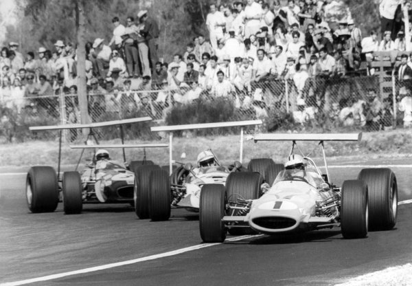 1968 Mexican Grand Prix.
Mexico City, Mexico. 3 November 1968.
Denny Hulme, McLaren M7A-Ford, retired, leads John Surtees, Honda RA301, retired, and Jack Brabham, Brabham BT26-Repco, 10th position, action.
World Copyright: LAT Photographic
Ref: Autosport b&w print 1968 Mexican Grand Prix.
Mexico City, Mexico. 3 November 1968.
Denny Hulme, McLaren M7A-Ford, retired, leads John Surtees, Honda RA301, retired, and Jack Brabham, Brabham BT26-Repco, 10th position, action.
World Copyright: LAT Photographic
Ref: Autosport b&w print