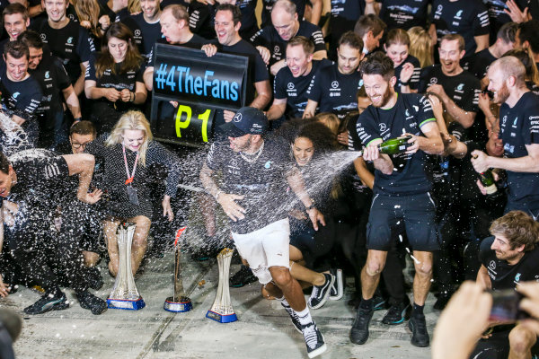 Yas Marina Circuit, Abu Dhabi, United Arab Emirates.
Sunday 26 November 2017.
Valtteri Bottas, Mercedes AMG, 1st Position, Lewis Hamilton, Mercedes AMG, 2nd Position, family, friends and the Mercedes team celebrate victory.
World Copyright: Charles Coates/LAT Images 
ref: Digital Image AN7T2740