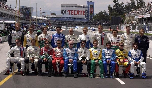 The Champ Car drivers pose for a photograph in the pitlane. Back row (L to R): Gualter Salles (BRA) Dale Coyne Racing, Rodolfo Lavin (MEX) Walker Racing, Mario Dominguez (MEX) Herdez Racing, Luis Diaz (MEX) Walker Racing, Roberto Moreno (BRA) Herdez Racing, Mika Salo (FIN) PK Racing, Ryan Hunter-Reay (USA) American Spirit Team Johansson, Roberto Gonzalez (MEX) Herdez Racing, Geoff Boss (USA) Dale Coyne Racing, Darren Manning (GBR) Walker Racing. Front row (L to R): Jimmy Vasser (USA) American Spirit Team Johansson, Tiago Monteiro (POR) Fittipaldi Dingman Racing, Adrian Fernandez (MEX) Fernandez Racing, Michel Jourdain Jr. (MEX) Team Rahal, Paul Tracy (CDN) Forsythe Racing, Bruno Junqueira (BRA) Newman Haas, Sebastien Bourdais (FRA) Newman Haas, Patrick Carpentier (CDN) Forsythe Racing, Mario Haberfeld (BRA) Conquest Racing, Alex Tagliani (CDN) Rocketsports Racing.
Champ Car World Series, Rd17, Mexico City, Mexico, 10-12 October 2003.
DIGITAL IMAGE The Champ Car drivers pose for a photograph in the pitlane. Back row (L to R): Gualter Salles (BRA) Dale Coyne Racing, Rodolfo Lavin (MEX) Walker Racing, Mario Dominguez (MEX) Herdez Racing, Luis Diaz (MEX) Walker Racing, Roberto Moreno (BRA) Herdez Racing, Mika Salo (FIN) PK Racing, Ryan Hunter-Reay (USA) American Spirit Team Johansson, Roberto Gonzalez (MEX) Herdez Racing, Geoff Boss (USA) Dale Coyne Racing, Darren Manning (GBR) Walker Racing. Front row (L to R): Jimmy Vasser (USA) American Spirit Team Johansson, Tiago Monteiro (POR) Fittipaldi Dingman Racing, Adrian Fernandez (MEX) Fernandez Racing, Michel Jourdain Jr. (MEX) Team Rahal, Paul Tracy (CDN) Forsythe Racing, Bruno Junqueira (BRA) Newman Haas, Sebastien Bourdais (FRA) Newman Haas, Patrick Carpentier (CDN) Forsythe Racing, Mario Haberfeld (BRA) Conquest Racing, Alex Tagliani (CDN) Rocketsports Racing.
Champ Car World Series, Rd17, Mexico City, Mexico, 10-12 October 2003.
DIGITAL IMAGE