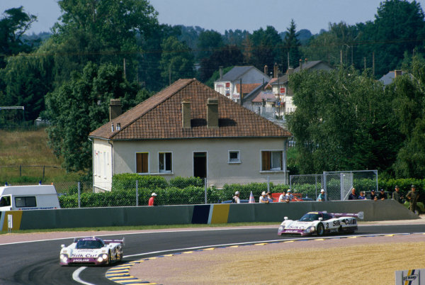 1990 Le Mans 24 Hours
Le Mans, France. 16th - 17th June 1990.
Martin Brundle/Alain Ferte/David Leslie (Jaguar XJR12), retired leads Martin Brundle/John Nielsen/Price Cobb/Eliseo Salazar (Jaguar XJR12), 1st position, action.
World Copyright: LAT Photographic.
Ref: 90LM45. 1990 Le Mans 24 Hours
Le Mans, France. 16th - 17th June 1990.
Martin Brundle/Alain Ferte/David Leslie (Jaguar XJR12), retired leads Martin Brundle/John Nielsen/Price Cobb/Eliseo Salazar (Jaguar XJR12), 1st position, action.
World Copyright: LAT Photographic.
Ref: 90LM45.