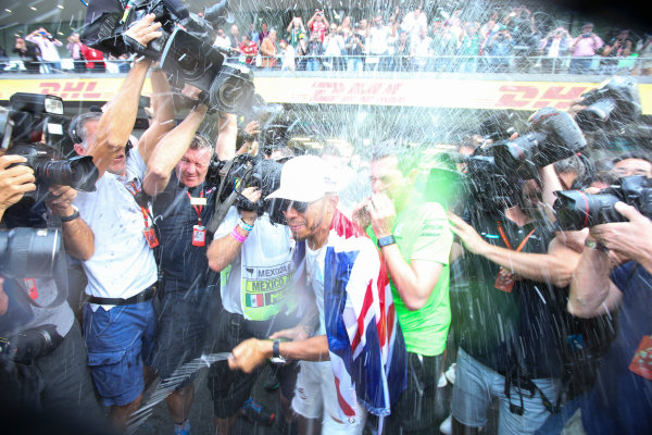 Autodromo Hermanos Rodriguez, Mexico City, Mexico.
Sunday 29 October 2017.
Lewis Hamilton, Mercedes AMG, sprays Champagne at photographers in celebration of securing his 4th world drivers championship title.
World Copyright: Charles Coates/LAT Images
ref: Digital Image DJ5R7721 Autodromo Hermanos Rodriguez, Mexico City, Mexico.
Sunday 29 October 2017.
Lewis Hamilton, Mercedes AMG, sprays Champagne at photographers in celebration of securing his 4th world drivers championship title.
World Copyright: Charles Coates/LAT Images
ref: Digital Image DJ5R7721