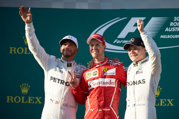 Albert Park, Melbourne, Australia.
Sunday 26 March 2017.
Lewis Hamilton, Mercedes AMG, 2nd Position, Sebastian Vettel, Ferrari, 1st Position, and Valtteri Bottas, Mercedes AMG, 3rd Position, on the podium.
World Copyright: Steve Etherington/LAT Images
ref: Digital Image SNE25432 Albert Park, Melbourne, Australia.
Sunday 26 March 2017.
Lewis Hamilton, Mercedes AMG, 2nd Position, Sebastian Vettel, Ferrari, 1st Position, and Valtteri Bottas, Mercedes AMG, 3rd Position, on the podium.
World Copyright: Steve Etherington/LAT Images
ref: Digital Image SNE25432