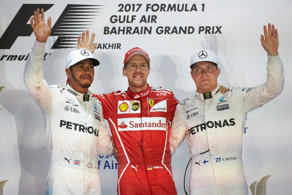 Bahrain International Circuit, Sakhir, Bahrain. 
Sunday 16 April 2017.
Lewis Hamilton, Mercedes AMG, 2nd Position, Sebastian Vettel, Ferrari, 1st Position, and Valtteri Bottas, Mercedes AMG, 3rd Position, on the podium.
World Copyright: Steve Etherington/LAT Images
ref: Digital Image SNE23064