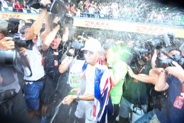 Autodromo Hermanos Rodriguez, Mexico City, Mexico.
Sunday 29 October 2017.
Lewis Hamilton, Mercedes AMG, sprays Champagne at photographers in celebration of securing his 4th world drivers championship title.
World Copyright: Charles Coates/LAT Images 
ref: Digital Image DJ5R7719