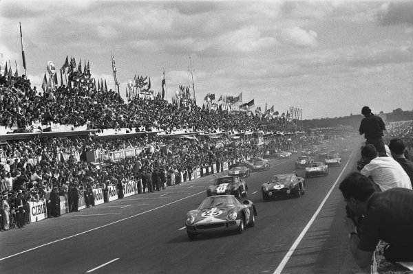 1965 Le Mans 24 Hours. Le Mans, France. 19th - 20th June 1965. Lucien Bianchi/Mike Salmon (Ferrari 250 LM), retired, leads Jean de Mortemart/Regis Fraissinet (Iso Grifo A3C), 9th position, at the start of the race, action. World Copyright: LAT Photographic. Ref: L65 - 268 - 4. 1965 Le Mans 24 Hours. Le Mans, France. 19th - 20th June 1965. Lucien Bianchi/Mike Salmon (Ferrari 250 LM), retired, leads Jean de Mortemart/Regis Fraissinet (Iso Grifo A3C), 9th position, at the start of the race, action. World Copyright: LAT Photographic. Ref: L65 - 268 - 4.