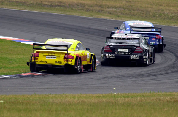 2002 DTM Championship
Lausitzring, Germany. 12th - 14th July 2002.
Mattias Ekstrom (Abt Audi TT-R), battles with Marcel Fassler (AMG Mercedes CLK) and Laurent Aiello (Abt Audi TT-R), action.
World Copyright: Andre Irlmeier/LAT Photographic
ref: Digital Image Only 2002 DTM Championship
Lausitzring, Germany. 12th - 14th July 2002.
Mattias Ekstrom (Abt Audi TT-R), battles with Marcel Fassler (AMG Mercedes CLK) and Laurent Aiello (Abt Audi TT-R), action.
World Copyright: Andre Irlmeier/LAT Photographic
ref: Digital Image Only