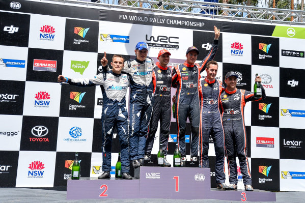 (L to R): Second placed Ott Tanak (EST) / Martin Jarveoja (EST), M-Sport World Rally Team WRC, rally winners Thierry Neuville (BEL) / Nicolas Gilsoul (BEL), Hyundai Motorsport WRC and third placed Hayden Paddon (NZL) / Sebastian Marshall (GBR), Hyundai Motorsport WRC celebrate on the podium at World Rally Championship, Rd13, Rally Australia, Day Three, Coffs Harbour, New South Wales, Australia, 19 November 2017. (L to R): Second placed Ott Tanak (EST) / Martin Jarveoja (EST), M-Sport World Rally Team WRC, rally winners Thierry Neuville (BEL) / Nicolas Gilsoul (BEL), Hyundai Motorsport WRC and third placed Hayden Paddon (NZL) / Sebastian Marshall (GBR), Hyundai Motorsport WRC celebrate on the podium at World Rally Championship, Rd13, Rally Australia, Day Three, Coffs Harbour, New South Wales, Australia, 19 November 2017.