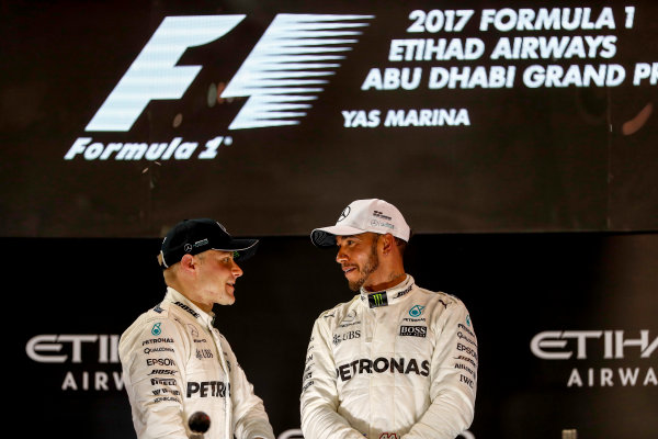 Yas Marina Circuit, Abu Dhabi, United Arab Emirates.
Sunday 26 November 2017.
Valtteri Bottas, Mercedes AMG, 1st Position, and Lewis Hamilton, Mercedes AMG, 2nd Position, on the podium.
World Copyright: Glenn Dunbar/LAT Images
ref: Digital Image _X4I0003 Yas Marina Circuit, Abu Dhabi, United Arab Emirates.
Sunday 26 November 2017.
Valtteri Bottas, Mercedes AMG, 1st Position, and Lewis Hamilton, Mercedes AMG, 2nd Position, on the podium.
World Copyright: Glenn Dunbar/LAT Images
ref: Digital Image _X4I0003
