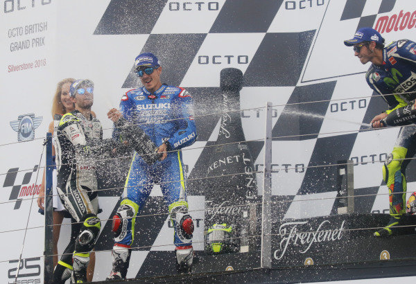 2016 MotoGP Championship. 
British Grand Prix. 
Silverstone, England. 2nd - 4th September 2016. 
Maverick Vinales, Suzuki, Cal Crutchlow, LCR Honda, and Valentino Rossi, Yamaha, celebrate on the podium. 
Ref: _W7_9523a. World copyright: Kevin Wood/LAT Photographic